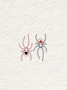 two spider's on white paper with red and black ink, one is in the middle