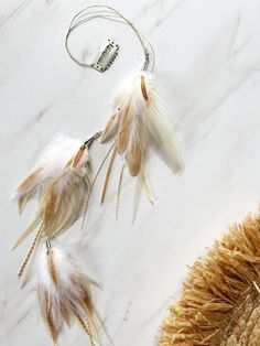 Every bride dreams of a unique and unforgettable wedding day. Make your dream a reality with this stunning feather hair clip, the perfect accessory for a boho-themed wedding. Crafted from natural feathers and high-quality metal components, this hair clip adds a touch of elegance and natural beauty to your bridal look. - Materials: Natural feathers, metal findings - Color: Soft cream with a hint of brown - Length: Approximately 21.65 inches (55 cm) Designed with the unique bride in mind, this feather hair clip ensures that you stand out with a one-of-a-kind look. Its lightweight design guarantees comfort throughout your special day, allowing you to shine effortlessly. Why Choose This Feather Hair Clip? - Handcrafted Excellence: Each clip is meticulously handmade, ensuring that no two pieces Boho Hair Accessories Wedding, Wedding Feathers, Boho Hair Accessories, Wedding Hair Clip, Hair Pins Bridal, Feather Hair Clips, Hair Accessories Wedding, Hair Accessories Boho, Feather Wedding