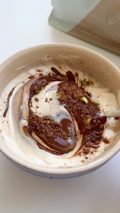 a bowl filled with ice cream and chocolate