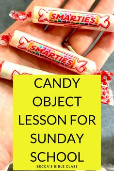 a hand holding three candy bars with the words candy object lesson for sunday school on it