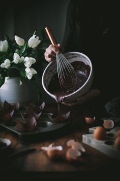 a person whisking chocolate in a bowl