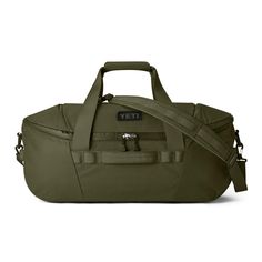 an olive green duffel bag with the word yeti on it's side