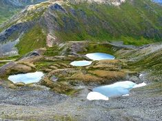 several small lakes in the middle of a mountain range