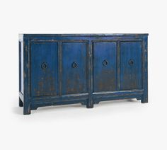 an old blue cabinet with three doors on one side and two drawers on the other