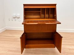 a wooden desk with drawers on top of it