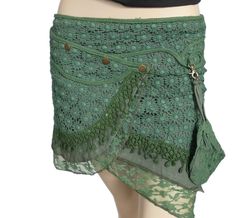 Elevate your style with our handmade pixie-inspired short cotton skirt. This navy leaf green mini wrap-around skirt features a multi-popper fastening for a customisable fit, enhancing your shape with a slight angle. The intricate lace and crochet details add a touch of bohemian charm. The detachable purse adds versatility for a night out, while the multi-layered design ensures a unique and eye-catching look. The skirt's vibrant hue appears to change in different lights, offering a dynamic and ka Steampunk Skirt, Mini Wrap Skirt, Belly Dance Outfit, Mini Wrap, Wrap Around Skirt, Leaf Green, Hippie Dresses, Fairy Dress, Cotton Skirt