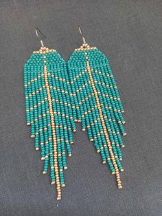 Leaf Green Gold Long Earrings Autumn Beaded Chandelier Earrings Blue Earrings Beaded Earrings Boho Earrings Beaded Earrings Fringe Earrings Earrings are 11,5 cm (4.52 inches) long with hooks and 3.5 cm (1.18 inches) wide., 100% handmade. You can find my other products in my store: https://www.etsy.com/shop/SilankaUa?ref=seller-platform-mcnav Please note that due to lighting effects, brightness, contrast and other monitor settings, there may be slight differences in the color tone/hue of the phot Elegant Green Hypoallergenic Beaded Earrings, Festive Green Beaded Earrings, Unique Green Beaded Earrings, Elegant Green Beaded Fringe Earrings, Green Beaded Fringe Earrings For Festival, Indigenous Beaded Earrings, Gold Long Earrings, Indigenous Crafts, Beaded Chandelier Earrings