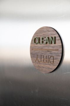 a close up of a metal surface with the words clean on it