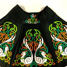 Details The Original Irish Dance Skirt. * * * ATTENTION The colors, which appear on your display may not reflect the colors of a real product. * * * The skirt consists of 6 parts (blades) with Celtic drawings. Before making an order, please specify your waist measurements and the desirable length of the skirt (from waist). Personal Skirt For Irish Dancing Practice And Competitions. You can either order this model of a skirt with default drawings or you can make a choice between available backgro Green Fitted Skort, Fitted Full Green Mini Skirt, Irish Clothes, Clothes Skirts, Irish Dancing, Tracksuit Outfit, Celtic Patterns, Celtic Style, Irish Dance