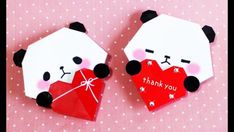 two panda bears holding a red heart with the words thank you written on it, sitting next to each other