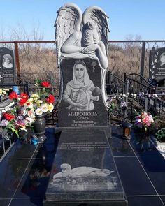 the memorial is surrounded by flowers and pictures