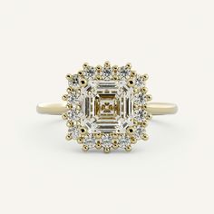 an oval cut diamond surrounded by small round brilliant diamonds in yellow gold and white gold