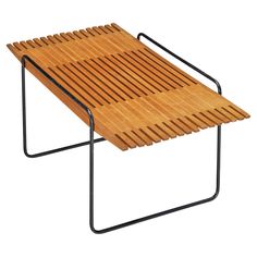 a wooden bench with metal frame and slatted design