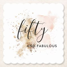 the words fifty and fabulous are painted in black ink on a white background with gold splat