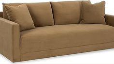 a tan couch with pillows on it and two pillow cases around the armrests