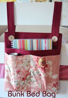 a pink flowered bag with buttons on it