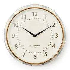 a white clock with black hands and numbers