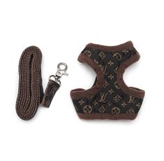 a brown and black dog harness next to a leash on a white background with an image of louis vuitton