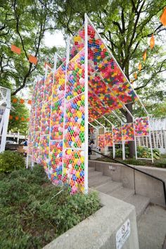 an art installation made out of balloons in the shape of a house