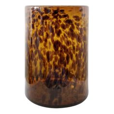 a brown and black vase sitting on top of a table