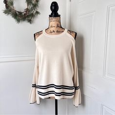 Nwt Anthropologie Knitted & Knotted Cold Shoulder Striped Bell Sleeve Sweater. Features: ~Open-Shoulder Silhouette ~Flared Bell Sleeves ~Contrast Stripes On The Arms And Bottom Hem ~Pullover Styling ~Color: Ivory/Cream With Navy Blue Stripes ~Cotton/Linen Blend Condition: New With Tags. New And Never Worn. Size M Pit To Pit Approx 23" Laid Flat Length Approx 23" (Top Of Strap To Hem) Sleeve Length Approx 19" Fabric: 97% Cotton; 3% Linen Keywords: Coastal Chic Nautical Closet Preppy Stripes Knit Chic Cream Pointelle Knit Sweater, Cozy Cream Knit Top For Spring, Cream Soft Knit Top For Spring, Chic Cream Ribbed Sweater, Chic Ribbed Cream Sweater, Stretch Cream Knit Top, Chic Cream Sweater With Soft Knit, Beige Pointelle Knit Sweater For Day Out, Chic Cream Soft Knit Sweater