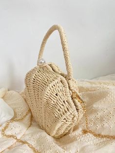 Chic and stylish, the Elena Handbags Summer Straw Shell Shape Shoulder Purse is a luxurious addition to your accessories. Crafted from straw and beautifully shaped like a seashell, this purse is an exquisite blend of form and function. Its elegant design makes it the ideal accessory for a day in the city or an evening on the beach. Size: 23cm wide x 15cm tall (9in x 6in) Designer Style ID: 8473 Summer Beach Bags Made Of Shell, Elegant White Woven Straw Bag, Beige Summer Fashion Bag, Summer Beige Bags As Fashion Accessory, Cream Bag With Pearl Handle For Summer, Summer Cream Bag With Pearl Handle, Summer Cream Bags With Pearl Handle, Elegant White Basket Straw Bag, Elegant Straw Beach Bag