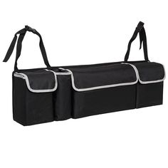 two black storage bags with white trims on the handles and bottom, hanging from one side