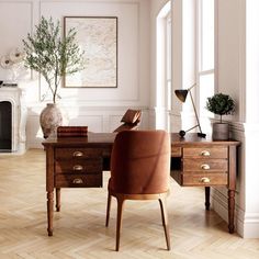 a desk with two chairs and a potted plant in the corner on top of it