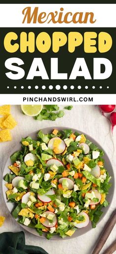 mexican chopped salad on a plate with tortilla chips and avocado in the background