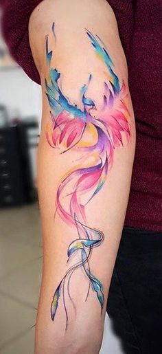 a woman with a colorful tattoo on her arm