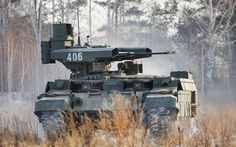 an army tank is driving through the snow