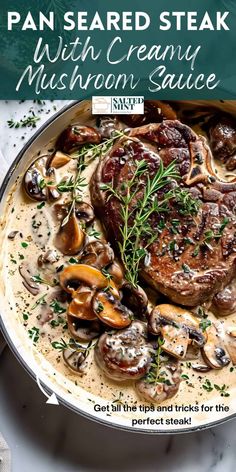 pan seared steak with creamy mushroom sauce in a skillet on a marble table