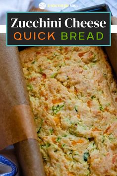 zucchini cheese quick bread in a baking pan with a blue ribbon around it