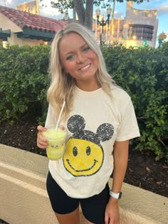 Smiley Tee – Wishes & Co. Cheap Disney Tops For Summer, Stoney Clover Disney Shirt, Disney Character Tee, Bright Disney Shirts, Disney Bound Shirts Summer, Comfy Clothes For Disney World, Adult Disney Shirts Summer, Smiley Necklace, Disney Trip Outfits