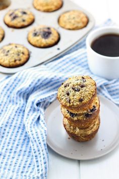 three cookies stacked on top of each other next to a cup of coffee