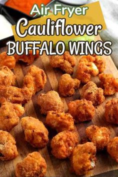 fried cauliflower buffalo wings on a cutting board with celery sticks and sauce in the background