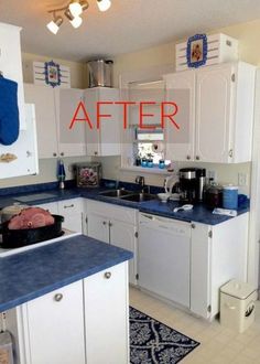 a kitchen with white cabinets and blue counter tops