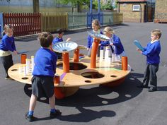 children playing with toys in an outdoor play area