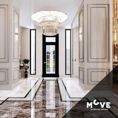 an elegant hallway with black and white marble flooring, chandelier and doors