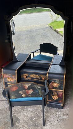 an antique vanity and stool are shown in front of a large mirror on the ground