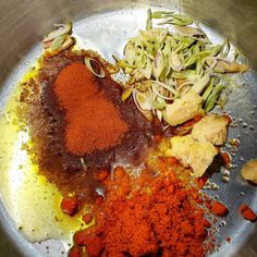 various spices and seasonings in a metal bowl