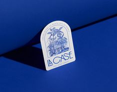 a sticker on the side of a blue car that says la case with palm trees