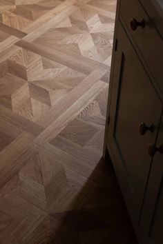 an image of a kitchen floor that looks like it has been made out of wood