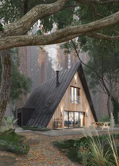 a house in the woods with trees around it