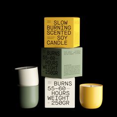 three different candles are stacked on top of each other and one candle is yellow in color