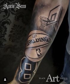 a man's arm with a basketball tattoo on it and the words spalding