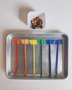 the toothbrushes are lined up and ready to be put in the container with them