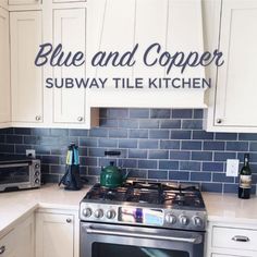 blue and copper subway tile kitchen backsplash with stainless steel stove top, white cabinets