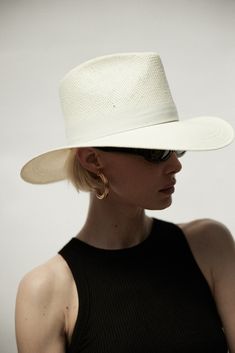 Design A classic fedora style made with packable straw. The structured fit creates a beautiful modern shape while staying true to the timeless design of our classic fedora. This effortless piece can easily be worn year-round and is meant for traveling with you wherever you go. Material Our most innovative design yet- a packable straw, that feels and looks like our Panama Straw. We created this straw with an incredibly durable fiber at its core. You can roll and pack it for up to 1 day and it wil Women Fedora, Packable Hat, Janessa Leone, Denim Shoes, Dress Hats, Summer Hats, Straw Hat, Leather Band, Gold Bands