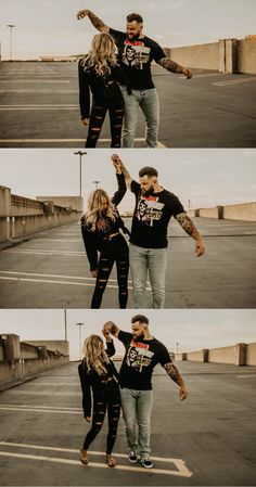 a man and woman standing in an empty parking lot with their arms around each other